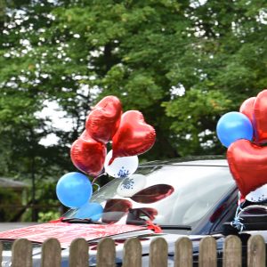 love heart balloons attached to a car
