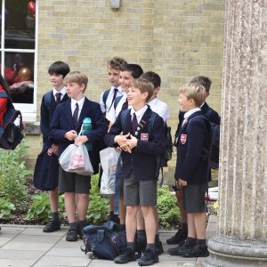 children from a prep school in Hampshire waiting in line